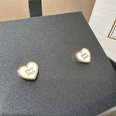 Miumiu Metal earrings Gold White